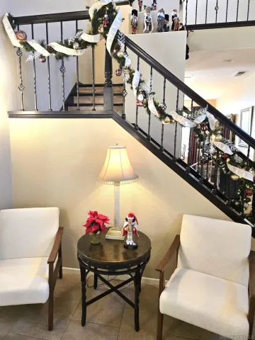 a living room with furniture and a chair