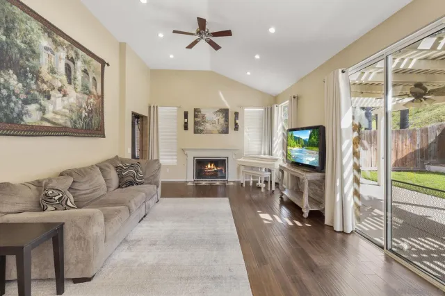 a living room with furniture and a fireplace