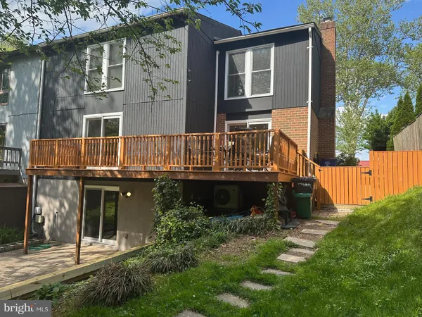 a view of a roof deck with wooden floor and fence