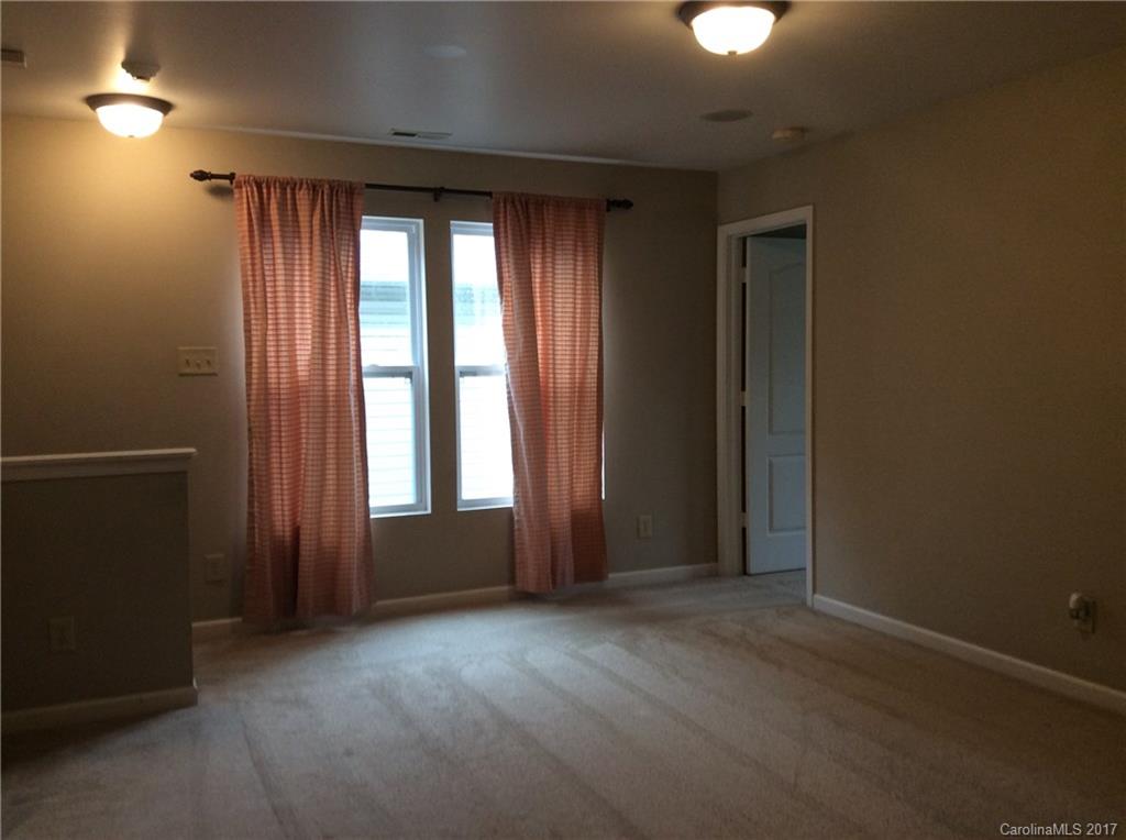 5409 Idlewild Road North Charlotte, NC 28227 - Photo 7 of 10 an empty room with windows and closet