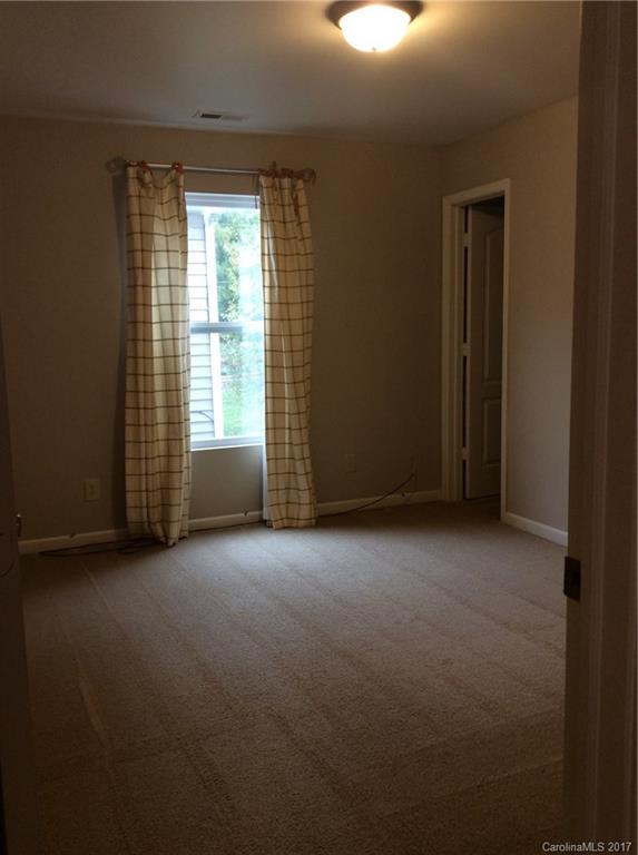 5409 Idlewild Road North Charlotte, NC 28227 - Photo 8 of 10 a view of an empty room with a window