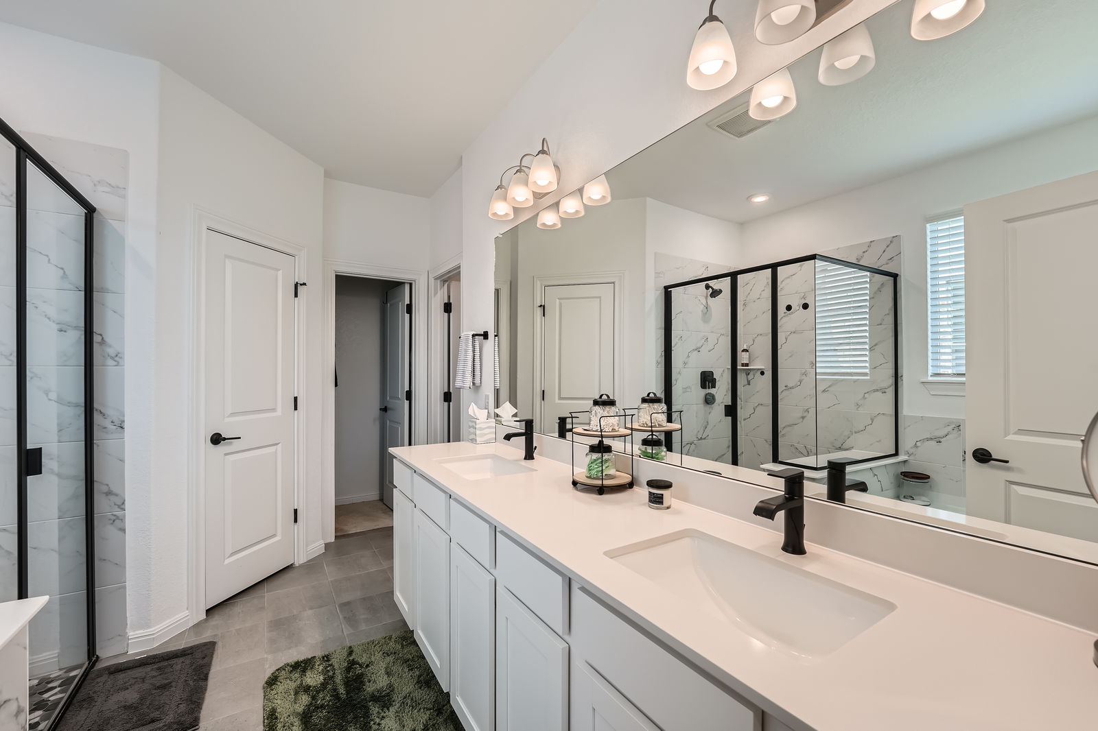 321 Georgia Lace Trail Georgetown, TX 78626 - Photo 14 of 27 Full bath with double vanity and a marble finish shower