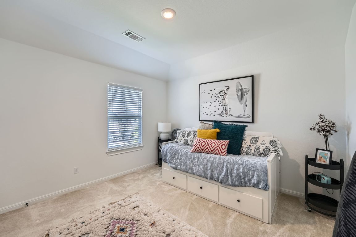 321 Georgia Lace Trail Georgetown, TX 78626 - Photo 18 of 28 Carpeted bedroom featuring baseboards