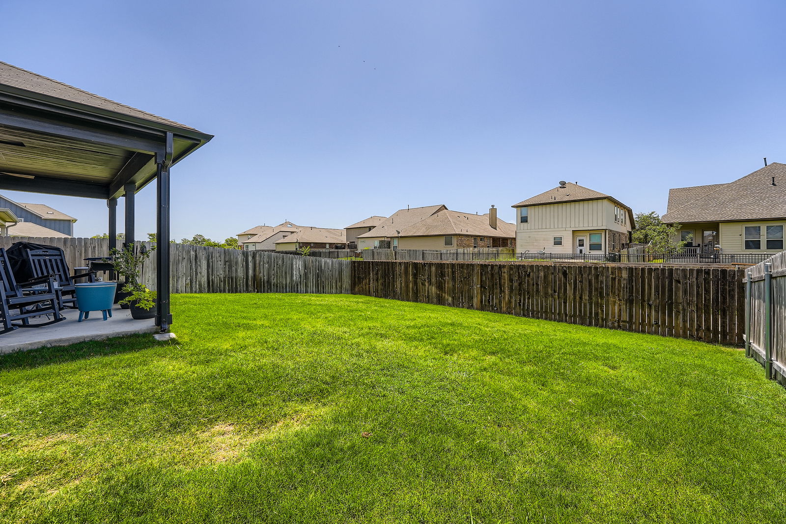 321 Georgia Lace Trail Georgetown, TX 78626 - Photo 23 of 27 Fenced backyard featuring a residential view and a patio area