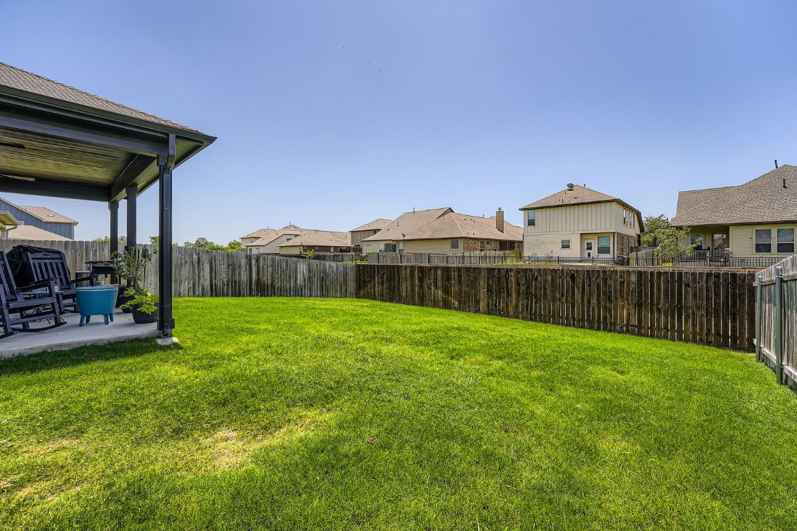 321 Georgia Lace Trail Georgetown, TX 78626 - Photo 24 of 28 Fenced backyard featuring a residential view and a patio area