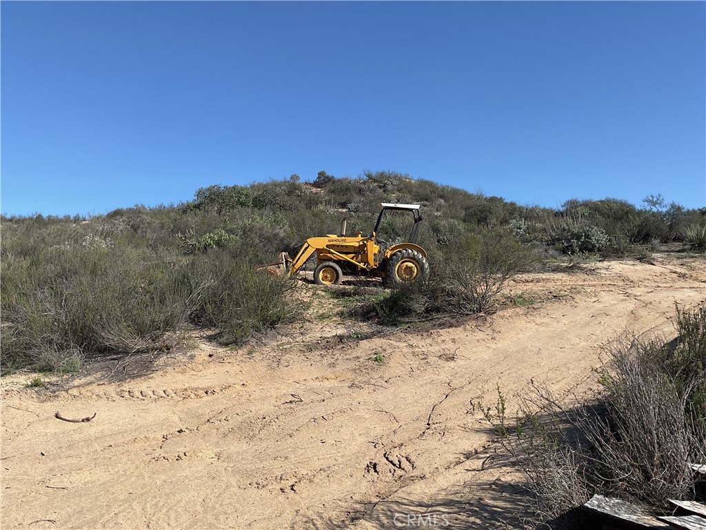 44545 Villager Valley Road Aguanga, CA 92536 - Photo 2 of 4 a view of a road with a yard