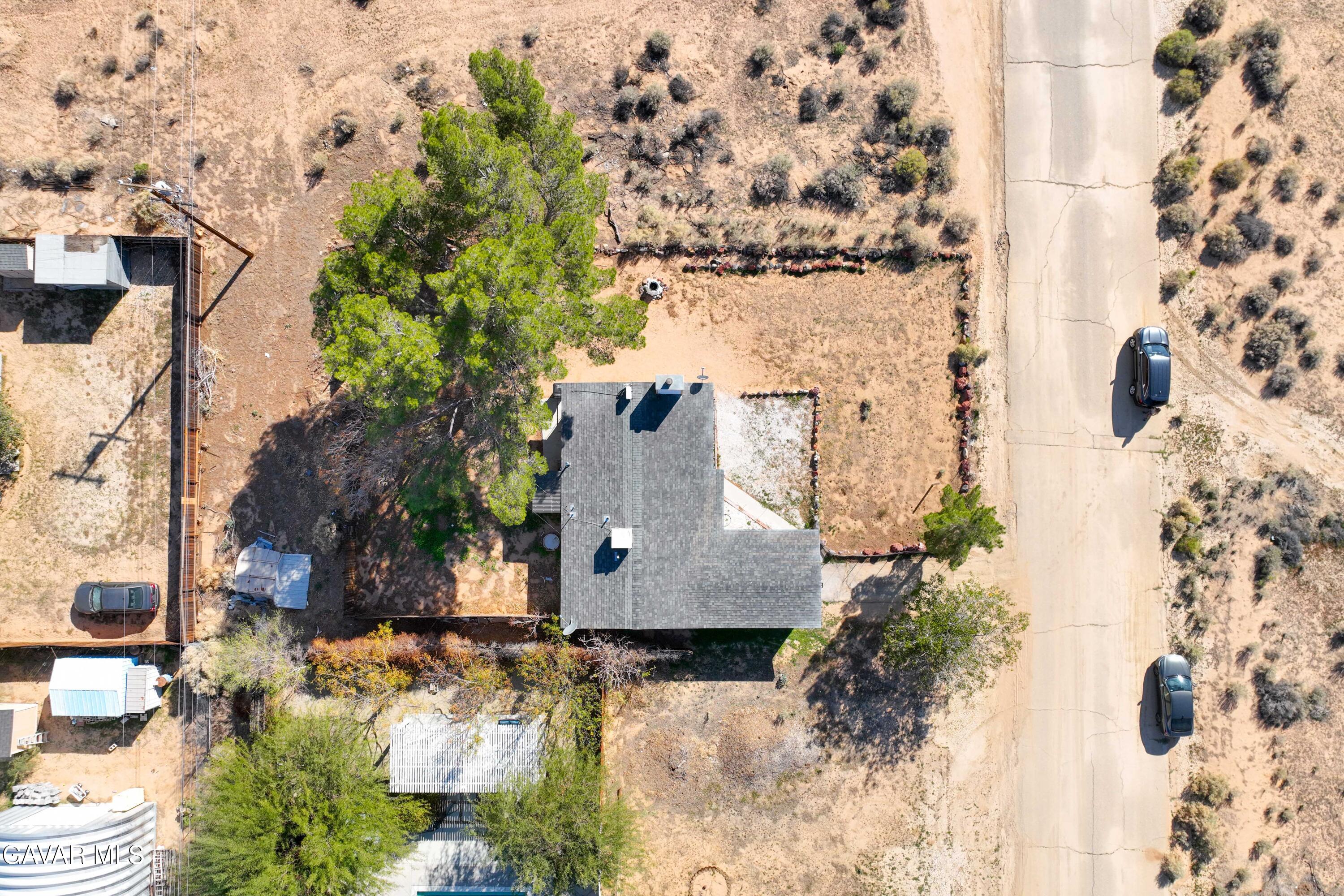 13656 Margo Street North Edwards, CA 93523 - Photo 23 of 24 an aerial view of a house with a yard and large trees