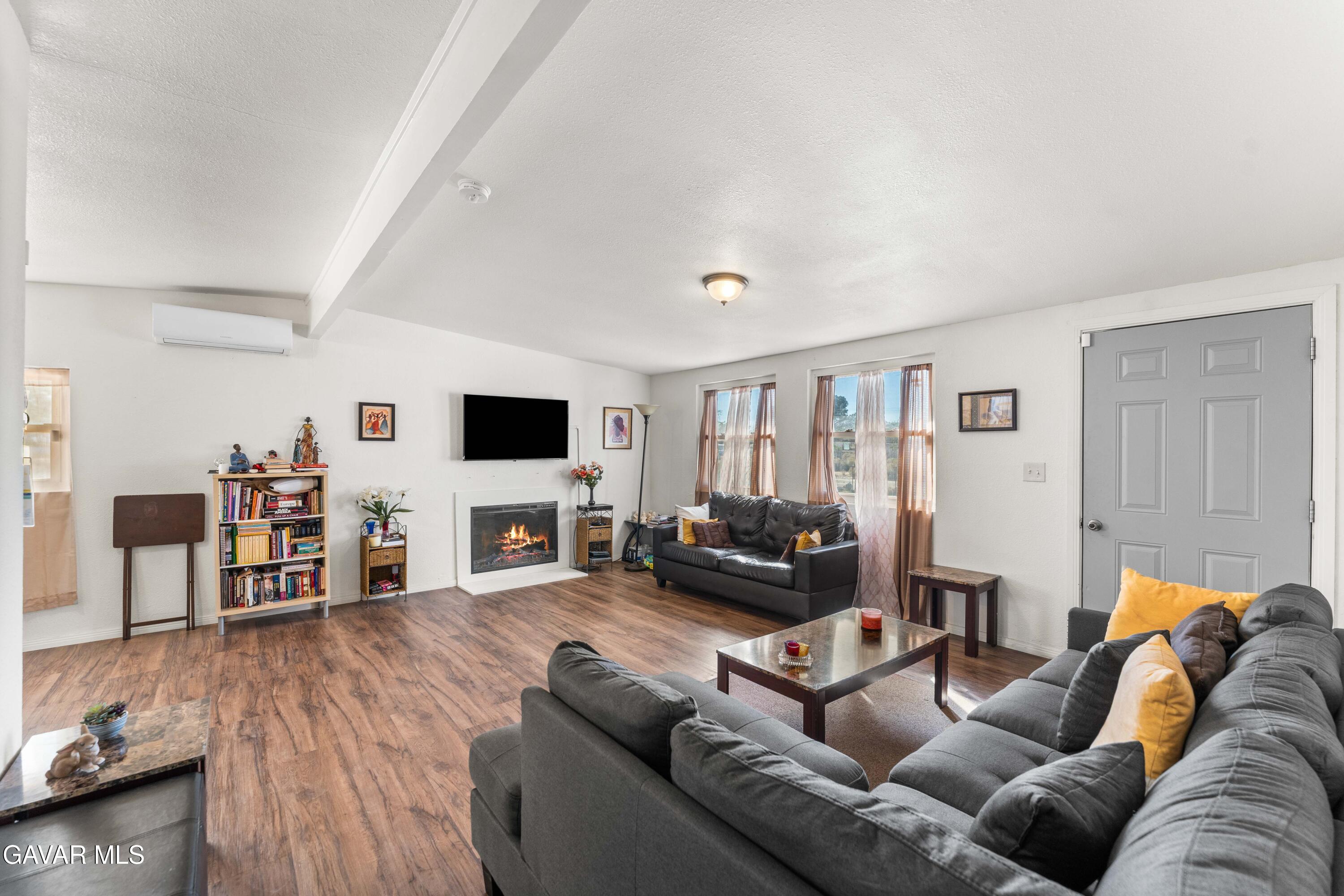13656 Margo Street North Edwards, CA 93523 - Photo 4 of 24 a living room with furniture and a flat screen tv