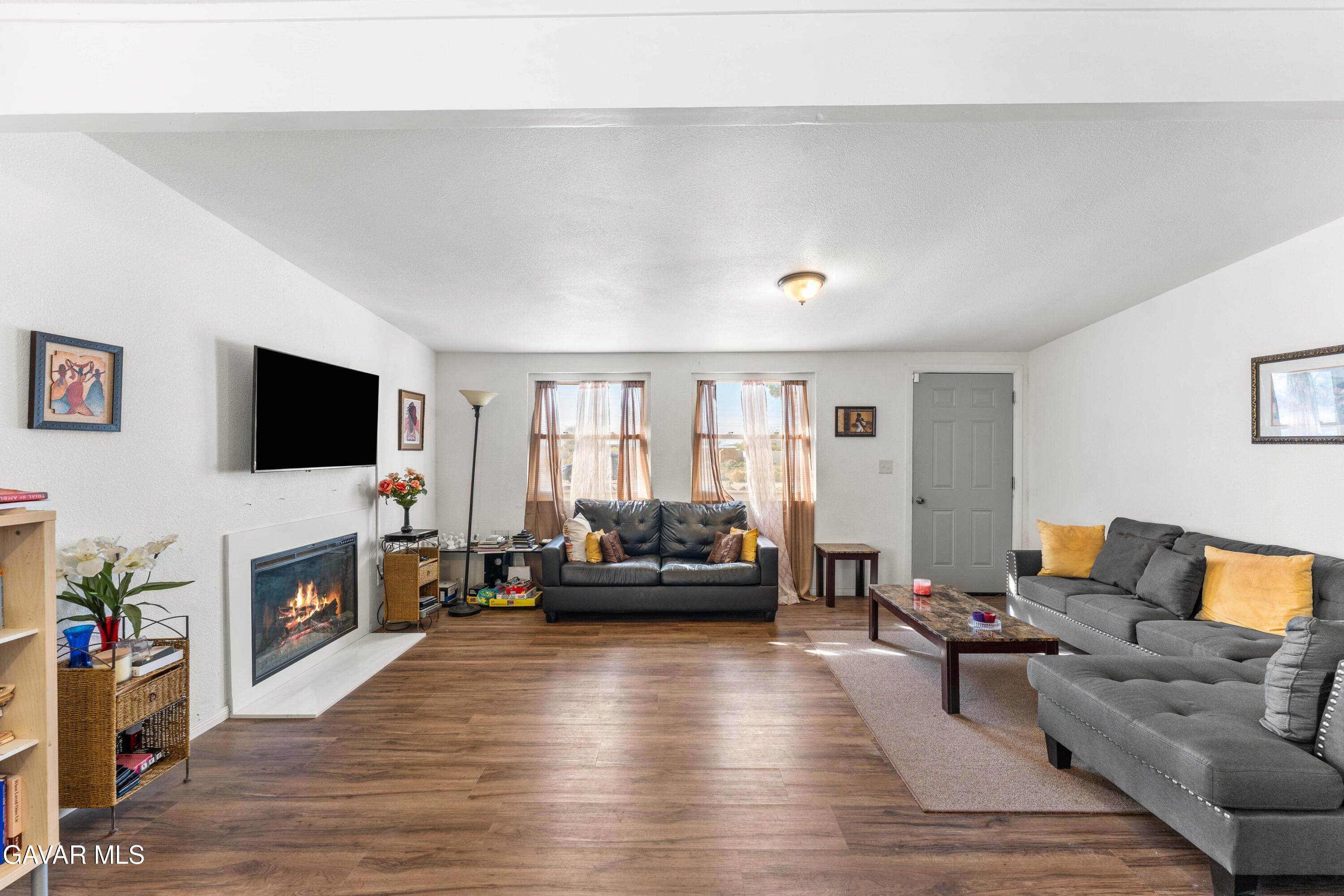 13656 Margo Street North Edwards, CA 93523 - Photo 5 of 24 a living room with furniture and a flat screen tv