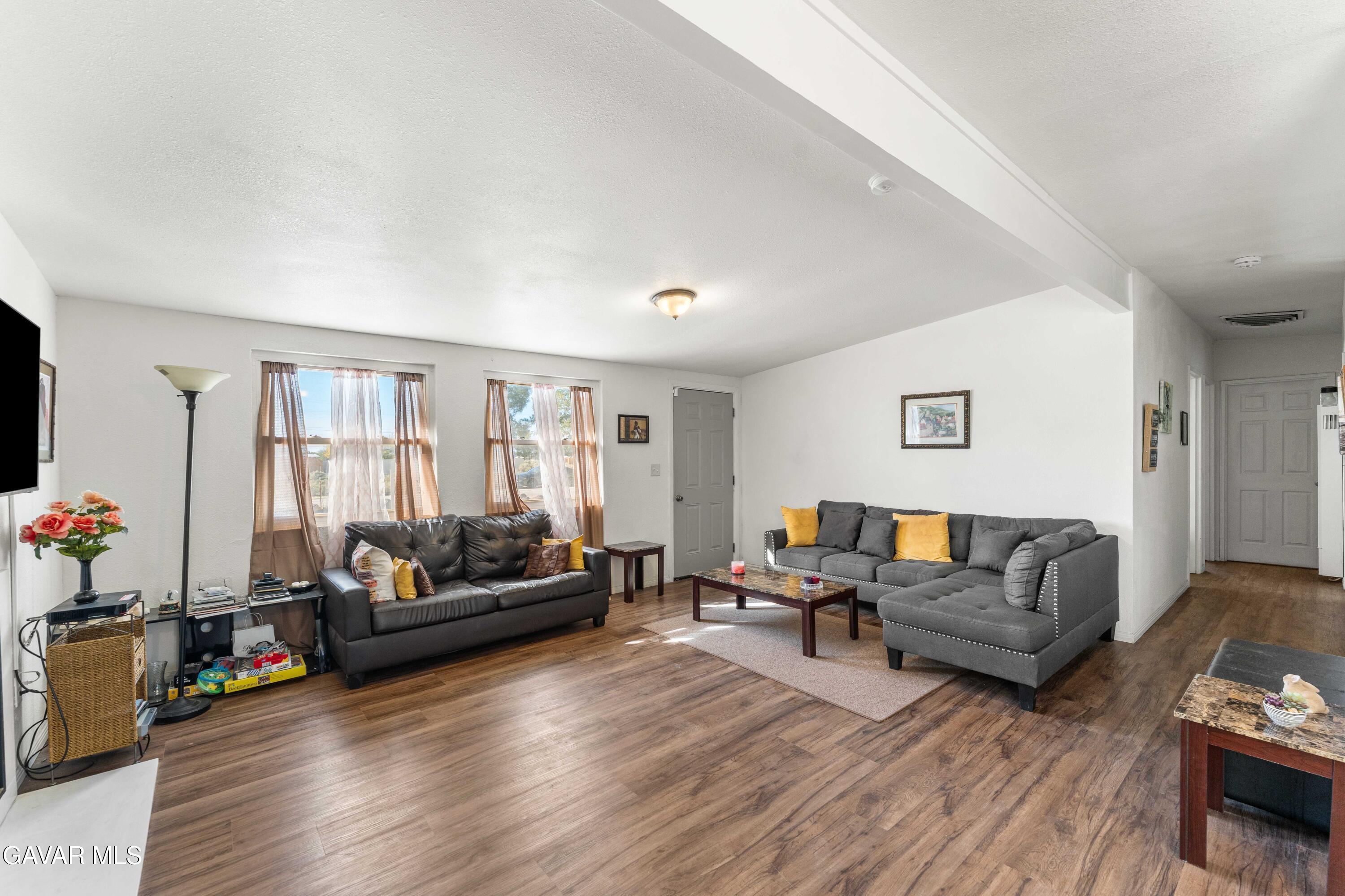13656 Margo Street North Edwards, CA 93523 - Photo 6 of 24 a living room with furniture window and wooden floor