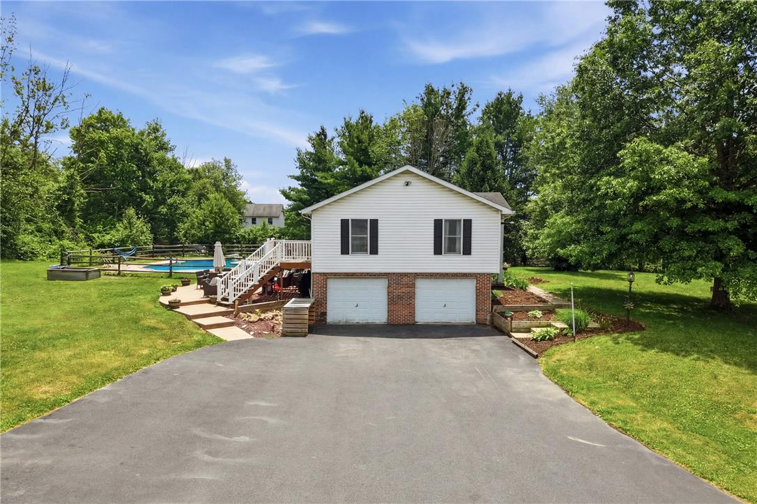 732 Bushkill Center Road Nazareth, PA 18064 - Photo 39 of 43 A private oasis awaits with a refreshing pool, expansive green space, and a two-car garage.