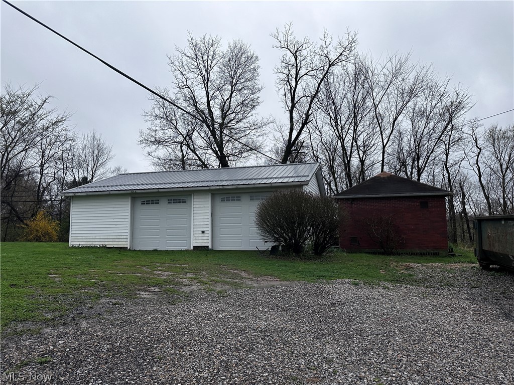 20002 Cadiz Road Quaker City, OH 43773 - Photo 16 of 19 Garage with a lawn