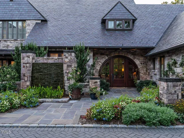 a front view of a house with garden