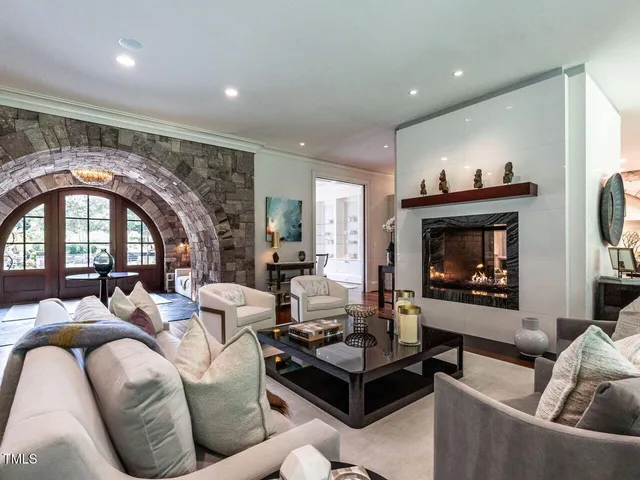 a view of a dining room with furniture wooden floor and chandelier