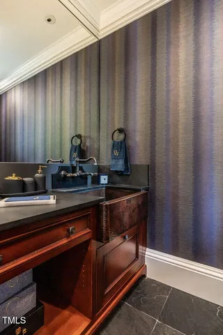 a living room with furniture and floor to ceiling windows