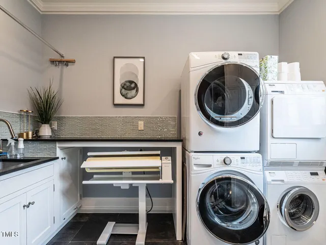 a view of a dining room with furniture large windows and wooden floor
