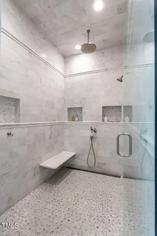 a view of a patio with a dining table and chairs with wooden floor