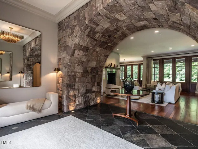 a living room with fireplace furniture and a flat screen tv