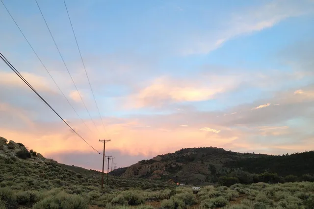 a view of mountain with sunset view