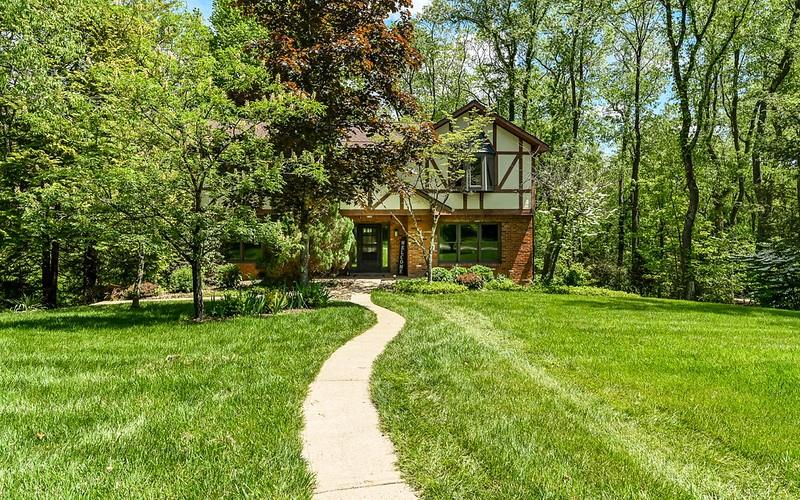 Nestled behind landscaping is a private oasis