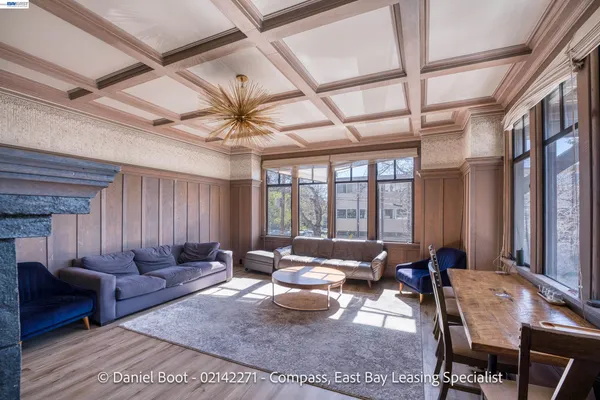 a living room with furniture ceiling fan and a rug
