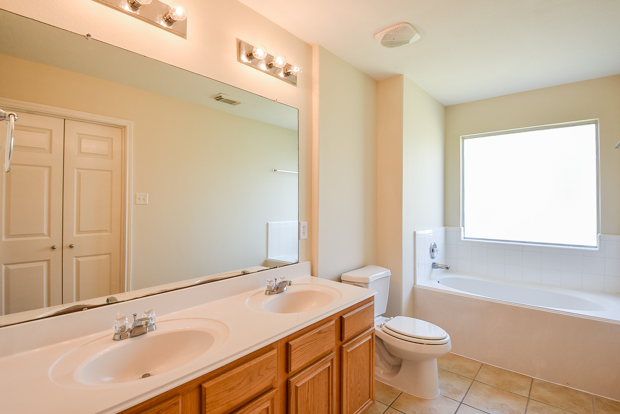 23527 Maple View Drive Spring, TX 77373 - Photo 12 of 25 a bathroom with a sink a toilet and shower