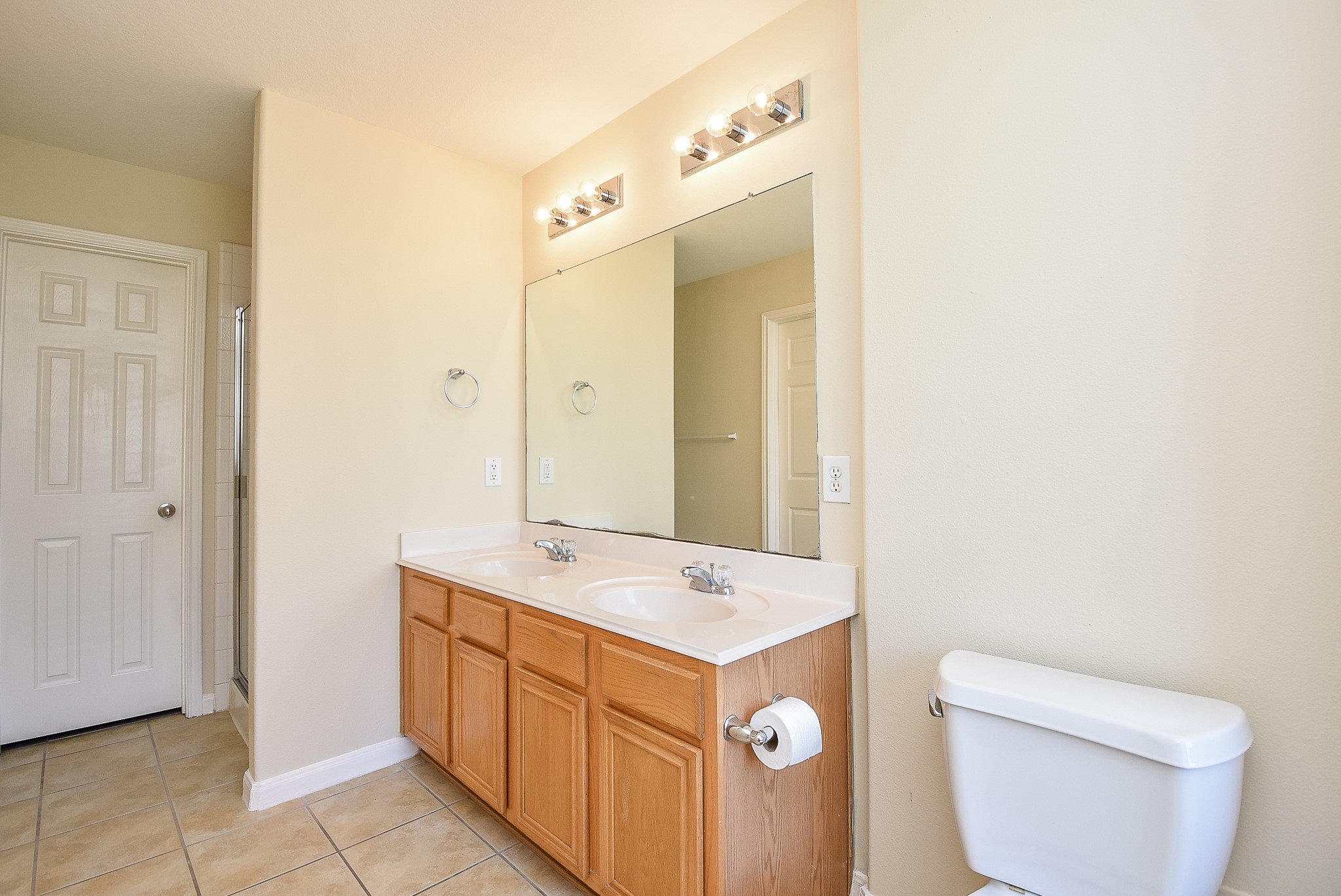 23527 Maple View Drive Spring, TX 77373 - Photo 13 of 25 a view of bathroom with a toilet sink and mirror