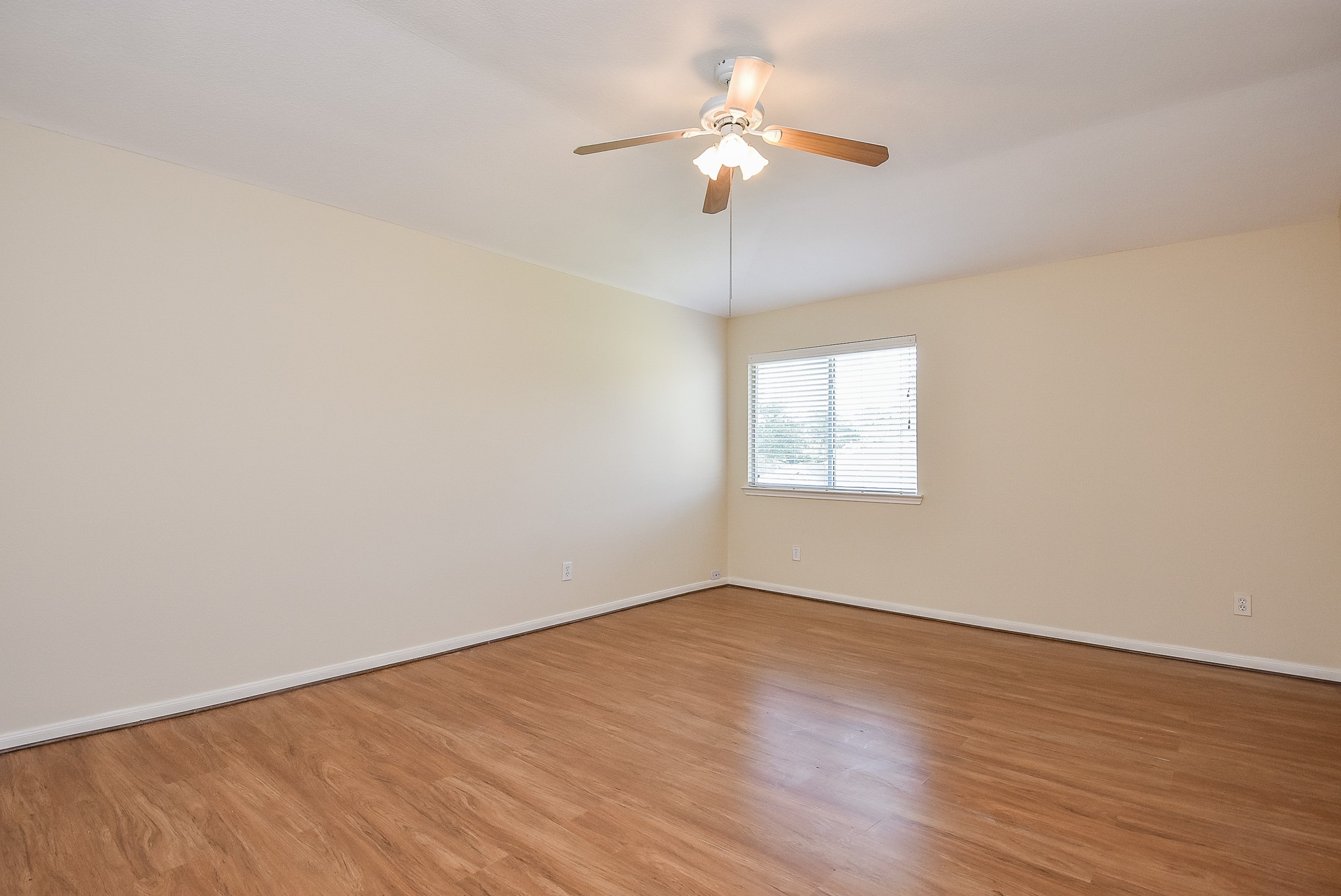 23527 Maple View Drive Spring, TX 77373 - Photo 17 of 25 wooden floor in an empty room with a window