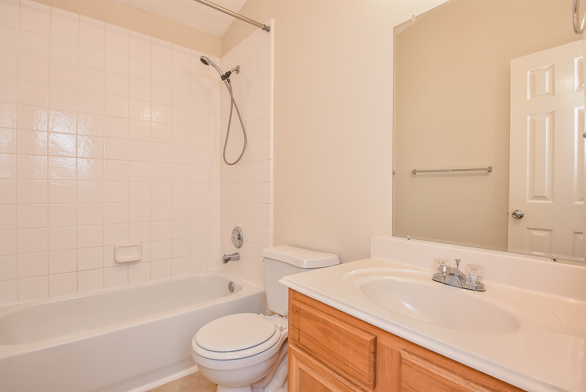 23527 Maple View Drive Spring, TX 77373 - Photo 20 of 25 a bathroom with a granite countertop sink a toilet and a bathtub
