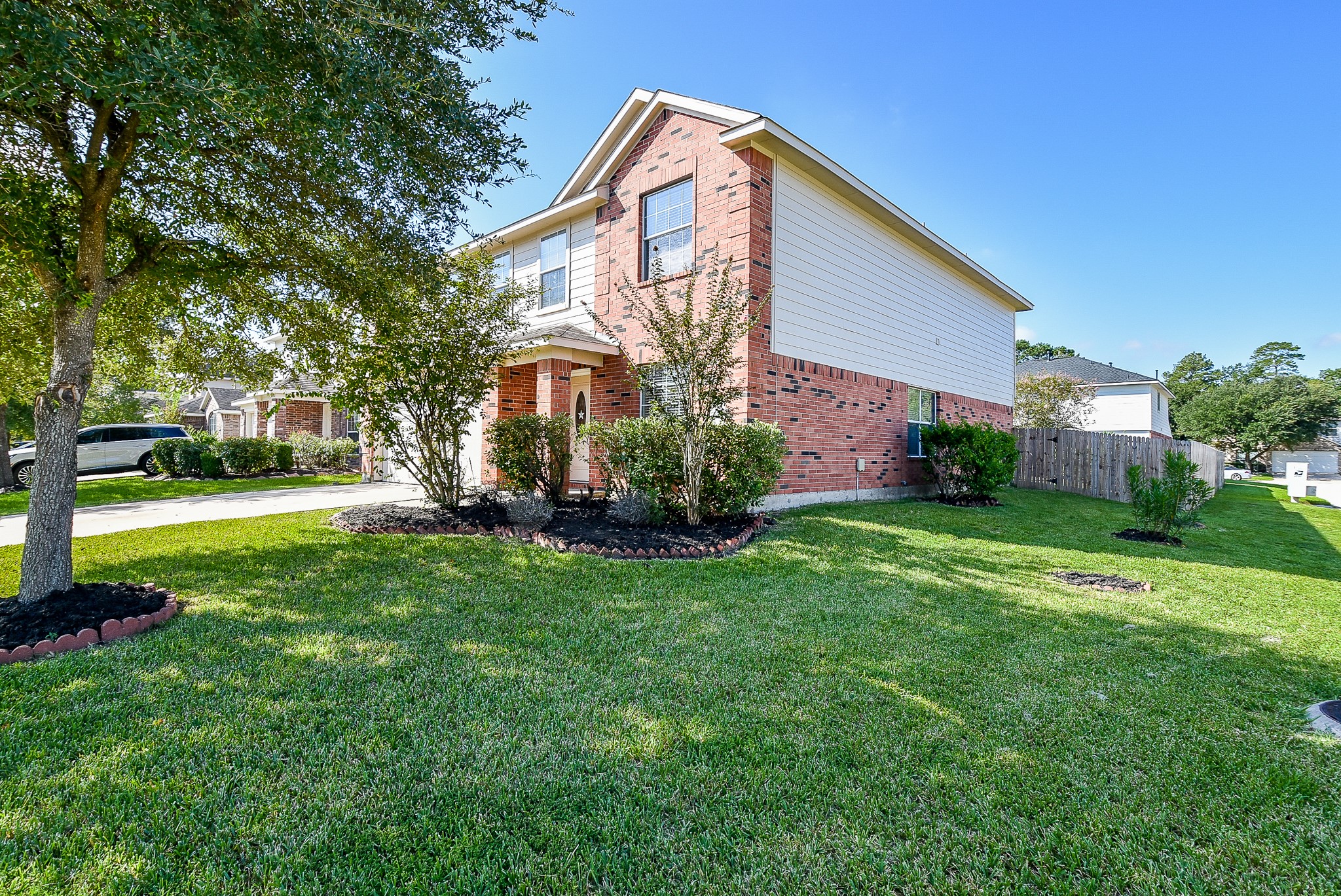 23527 Maple View Drive Spring, TX 77373 - Photo 2 of 25 a front view of house with yard and green space