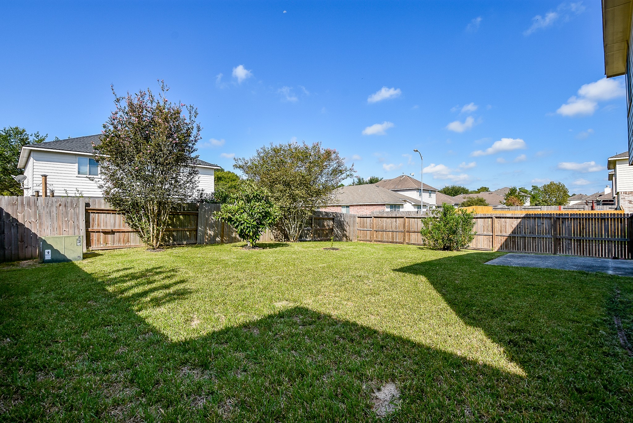 23527 Maple View Drive Spring, TX 77373 - Photo 25 of 25 a view of a backyard with plants and a garden