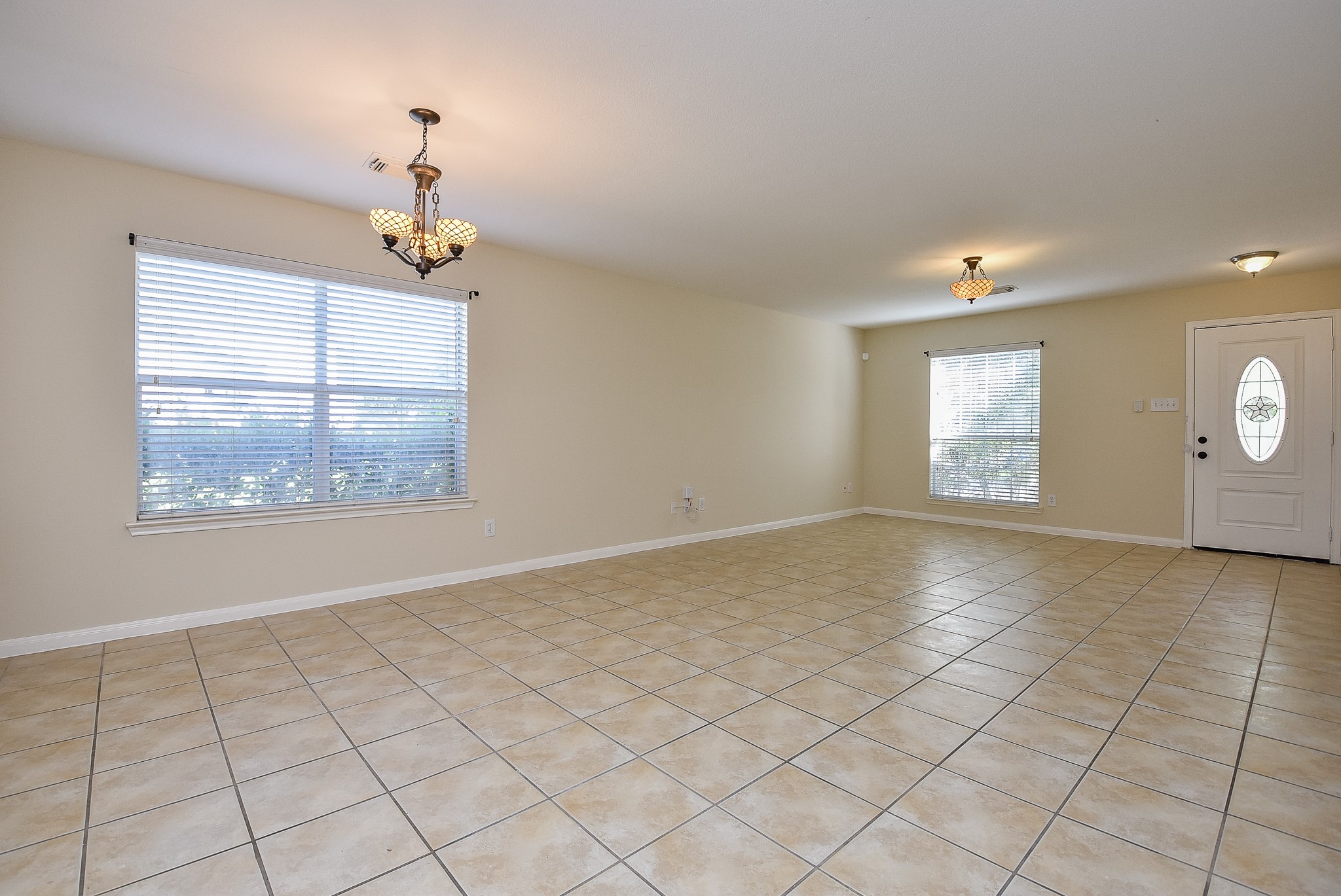 23527 Maple View Drive Spring, TX 77373 - Photo 4 of 25 an empty room with windows and fan
