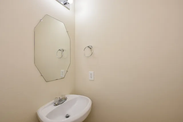 a bathroom with a sink and mirror