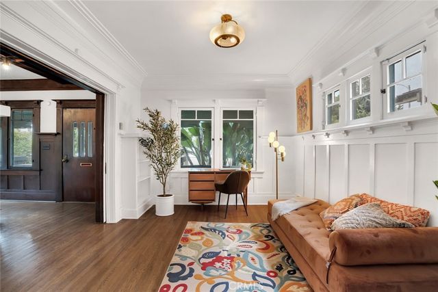 a bedroom with furniture and a window