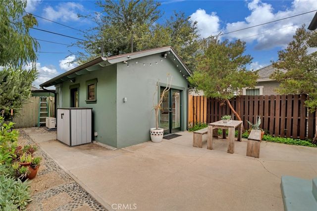 a view of a chair and table in the patio