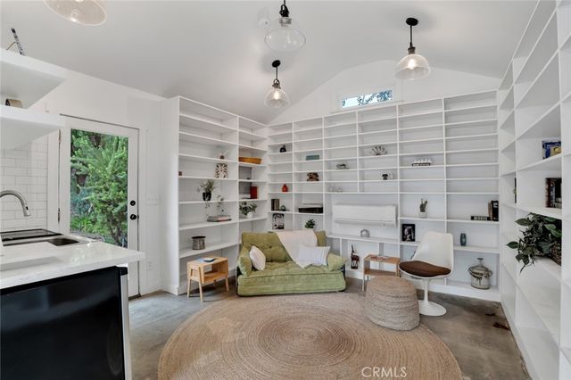 a view of a livingroom with furniture and windows