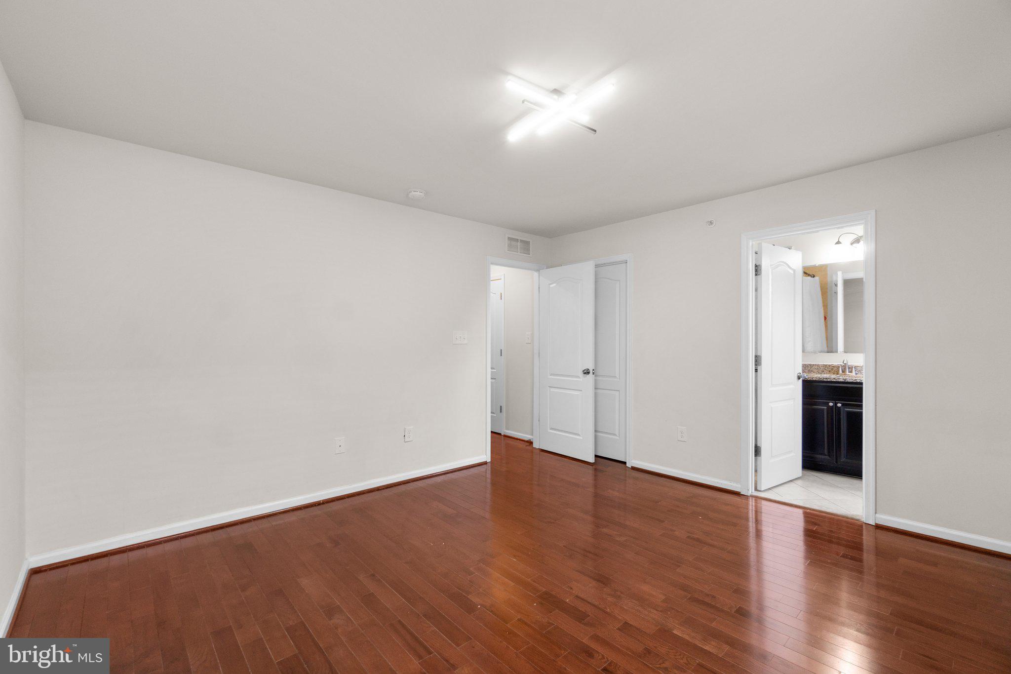 8020 Ravenclaw Road Elkridge, MD 21075 - Photo 19 of 38 a view of an empty room with wooden floor