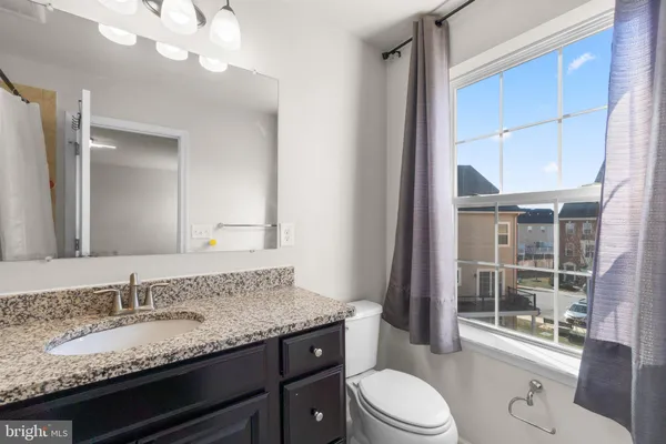 a bathroom with a shower and a bath tub