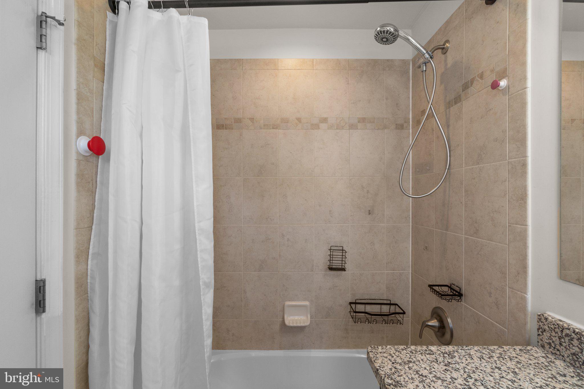 8020 Ravenclaw Road Elkridge, MD 21075 - Photo 21 of 38 a bathroom with a shower and a bath tub