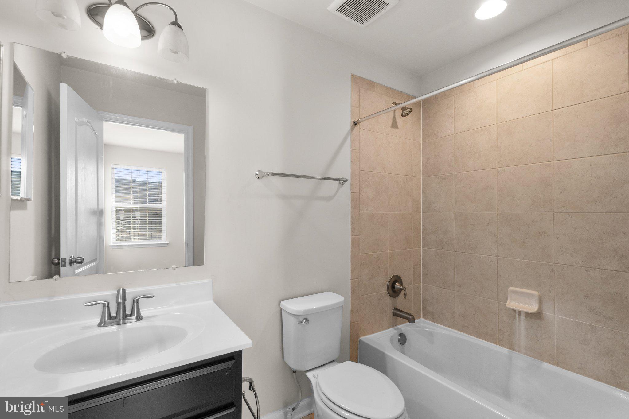 8020 Ravenclaw Road Elkridge, MD 21075 - Photo 25 of 38 a bathroom with a sink toilet and shower