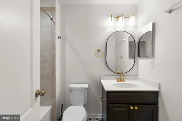 a bathroom with a shower and a bath tub