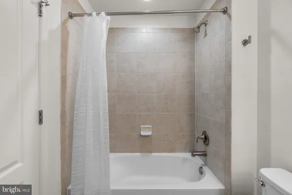 a view of a balcony with wooden floor and fence