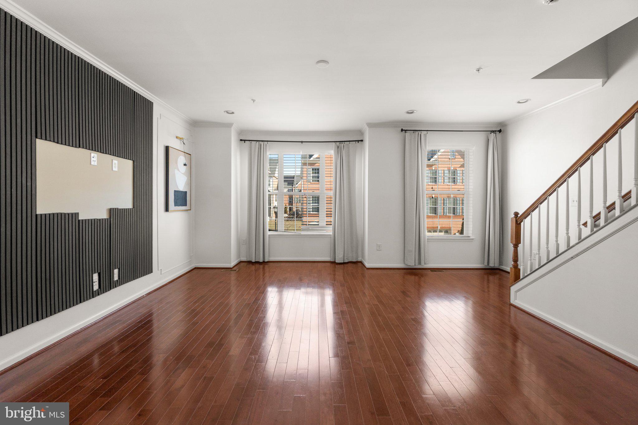 8020 Ravenclaw Road Elkridge, MD 21075 - Photo 3 of 38 a view of an empty room with wooden floor and a window