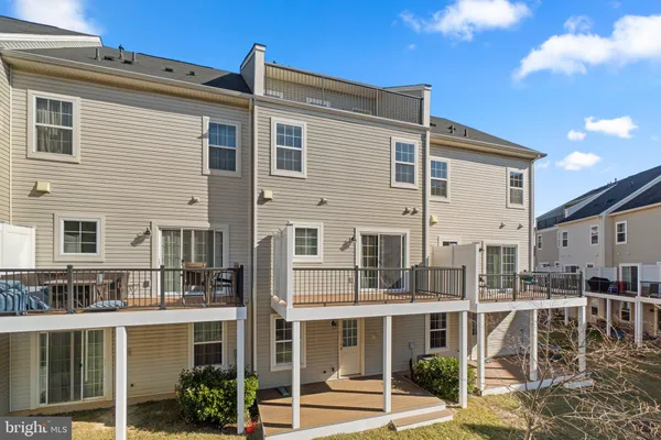 a front view of a house with a yard table and chairs