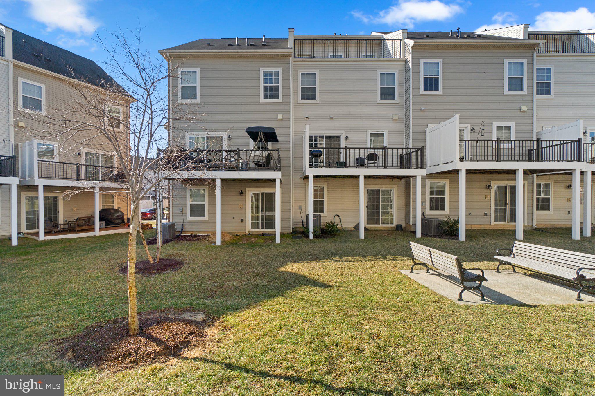 8020 Ravenclaw Road Elkridge, MD 21075 - Photo 35 of 38 a front view of a house with a yard table and chairs