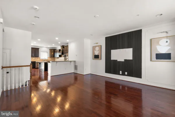 a view of kitchen with furniture and wooden floor