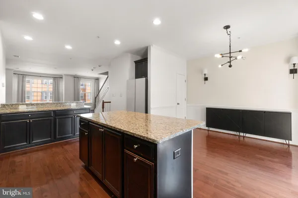a kitchen with granite countertop counter top space and cabinets