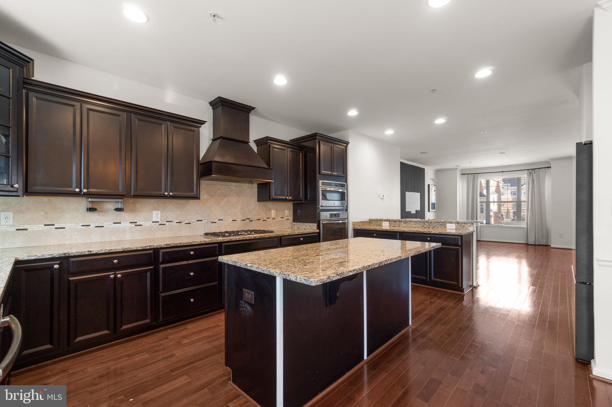 8020 Ravenclaw Road Elkridge, MD 21075 - Photo 8 of 38 a kitchen with a sink and cabinets