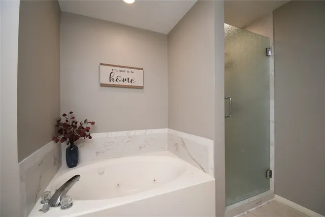 a white bath tub sitting in a bathroom