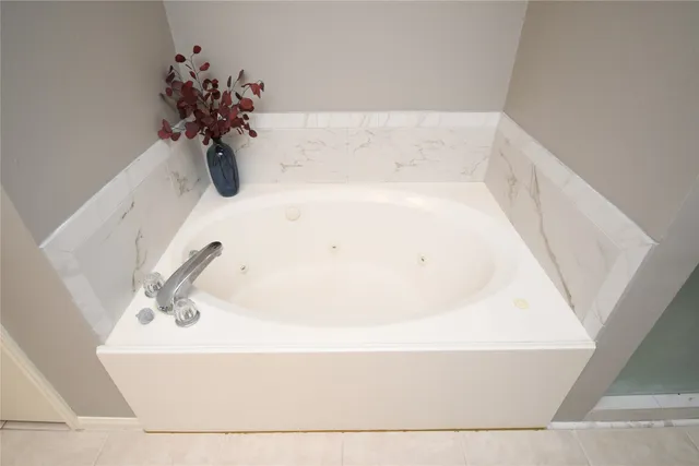 a white bath tub sitting in a bathroom